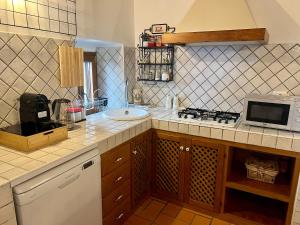 Kuchyň nebo kuchyňský kout v ubytování La Casa Ocra Suite