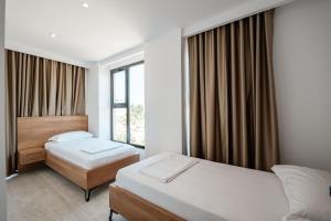 Postel nebo postele na pokoji v ubytování Hotel EN AD