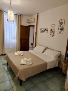 Postel nebo postele na pokoji v ubytování La Casa Ocra Suite