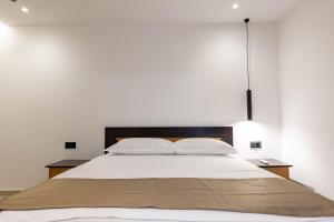 Postel nebo postele na pokoji v ubytování Hotel EN AD