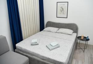 Postel nebo postele na pokoji v ubytování Nano Apartment