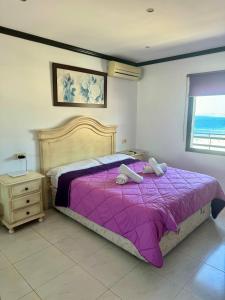 En eller flere senge i et værelse på Apartamentos Mediterraneo