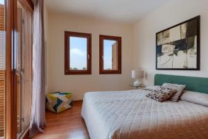 a bedroom with a bed and two windows at Aphrodite Hills Junior Villas Junior Villa J032 Air Conditioning Private Pool 2 Bedrooms P in Paphos +8 photos
