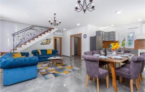 a dining room and living room with a table and chairs at Beautiful Home In Pinezici With Kitchen in Pinezici