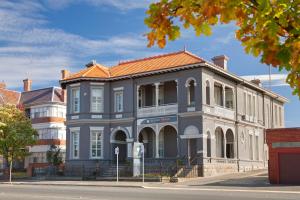 a large building with an orange roof on a street at Ballarat Premier Apartments in Ballarat