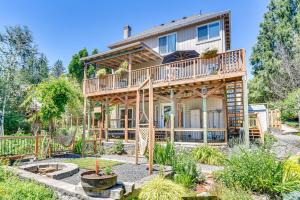 a custom built log home with a deck at Secret Garden Healing Retreat! Beavertin Nike Area in Beaverton