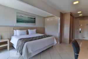 Кровать или кровати в номере Rio Plaza - Suítes no Rio de Janeiro por Carpediem