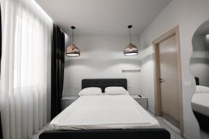Katil atau katil-katil dalam bilik di Hotel Ble Ble Vlore