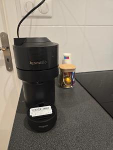 a coffee maker sitting on top of a counter at Sarah in Aix-les-Bains