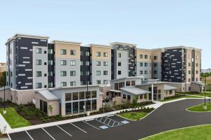 an aerial view of a building with a parking lot at Residence Inn by Marriott Indianapolis Noblesville in Noblesville