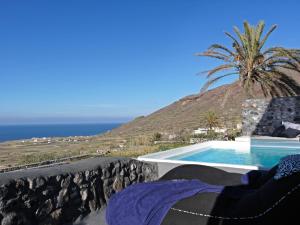 a swimming pool with a view of the ocean at Luxury Santorini Villa Villa Elysian Pente Private Pool 2 Bedrooms in Foinikiá