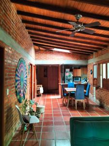 a patio with a table and chairs and a ceiling at Cabaña vida in Santa Marta +46 photos