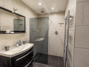 a bathroom with a sink and a shower at Cabirat in Salles-de-Belvès +18 photos