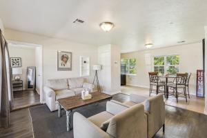a living room with a couch and a table at 2br Family Getaway With Wifi Smart Tv #ta in Oklahoma City