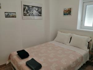 Postel nebo postele na pokoji v ubytování Ajuda Apartment