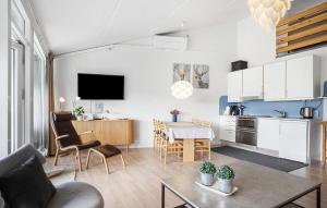 a living room with a kitchen and a dining room at Beautiful Apartment In Ringkøbing in Ringkøbing
