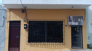 a gate on the side of a building at Apartamento en la Zona Colonial in Santo Domingo +2 photos