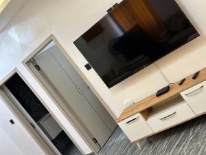 a kitchen with a large tv on top of a cabinet at Aberdeen Richview Luxury Apartments Full 1 Bedroom Apartment Sleeps 3 A200 in Freetown