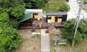 an overhead view of a house with a train station at Tiny Homes & Sauna NOZAWA in Iiyama