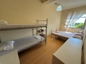 Postel nebo postele na pokoji v ubytování Garden Hostel
