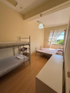 Postel nebo postele na pokoji v ubytování Garden Hostel