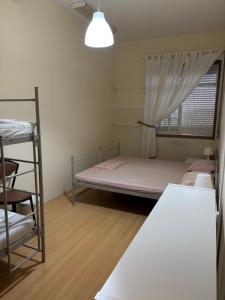Postel nebo postele na pokoji v ubytování Garden Hostel
