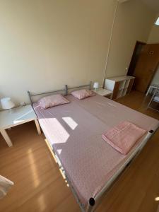 Postel nebo postele na pokoji v ubytování Garden Hostel
