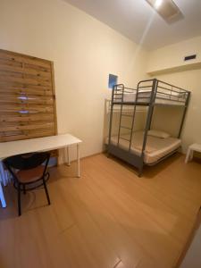 Postel nebo postele na pokoji v ubytování Garden Hostel