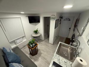 an aerial view of a living room with a sink at Seabreeze Cottage in Lantana