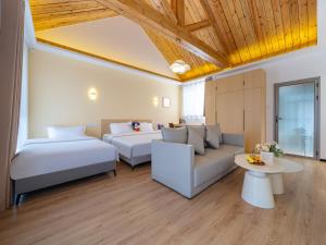 Postel nebo postele na pokoji v ubytování JOYSEA HUT