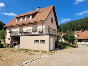 a large house with a balcony on top of it at Holiday Home in Reipertswiller near Castle in Reipertswiller