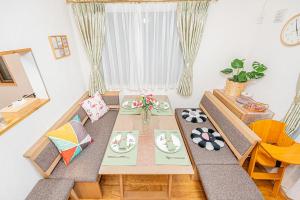 a living room with a table and two chairs at Anzu 4 Bed rooms Villa 5 minutes walk from Keise line Edogawa station in Tokyo