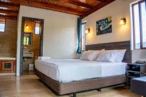 Postel nebo postele na pokoji v ubytování Toucan Platinum Suites Aparthotel