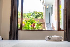 Postel nebo postele na pokoji v ubytování Toucan Platinum Suites Aparthotel