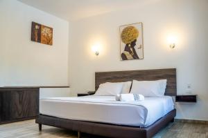 Postel nebo postele na pokoji v ubytování Toucan Platinum Suites Aparthotel