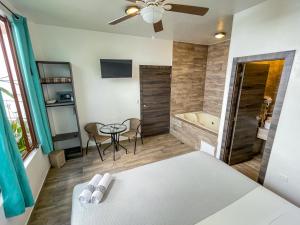 Postel nebo postele na pokoji v ubytování Toucan Platinum Suites Aparthotel