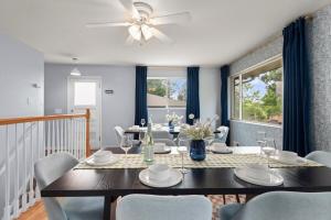 a dining room with a table and chairs at Cozy 5BR - Outdoor Theater, Fire Pit, Games in Westminster