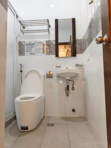 a bathroom with a toilet and a sink at m4 Private Villa in Angeles