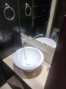 a bathroom with two sinks and a mirror at Las Marías in Chilecito +5 photos