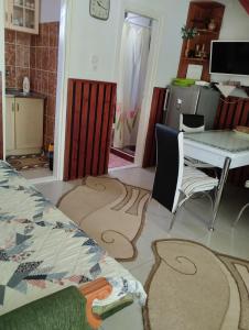 A kitchen or kitchenette at Barázda Apartman