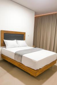 Postel nebo postele na pokoji v ubytování Hotel El Faro - Desayunos incluidos - Manga, Cartagena