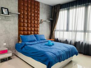 Ένα ή περισσότερα κρεβάτια σε δωμάτιο στο Dainty Homes at i-City WiFi TV Box and 1 Carpark