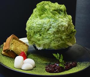a plate of food with lettuce and bread and fruit at KOKO HOTEL Osaka Namba Ebisucho in Osaka