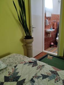 A bed or beds in a room at Barázda Apartman
