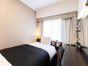 Кровать или кровати в номере APA Hotel Tennoji Ekimae