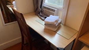 a desk with towels on top of a table at 2218NColoradoC in Philadelphia +4 photos