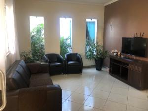 Et tv og/eller underholdning på Casa Confortável e aconchegante