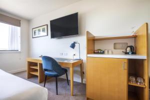 Sjónvarps- og/eða afþreyingartæki á Gateway Hotel by Nightcap Plus