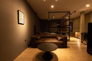 a living room with a couch and a table at Midas Home in Da Lat +12 photos