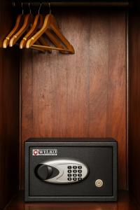 a television with a remote control sitting inside of it at Sena Boutique Hotel & Travel in Hanoi